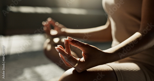 Meditation  hands woman in lotus pose on a floor for peace  zen or mental health wellness at home. Breathing  relax and female person in living room for energy training  exercise or holistic practice