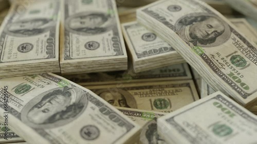 Stacks upon stacks of one hundred dollars