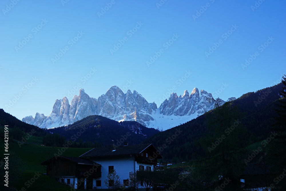 Landscape of Santa Maddalena and exterior village buildings at Val di Funes, land of the pale mountains and beautiful valley in the Dolomites also one of UNESCO World Heritage site- South Tyrol, Italy