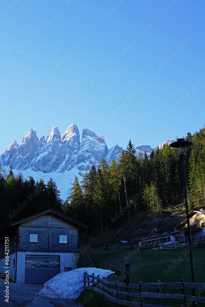 Landscape of Santa Maddalena and exterior village buildings at Val di Funes, land of the pale mountains and beautiful valley in the Dolomites also one of UNESCO World Heritage site- South Tyrol, Italy