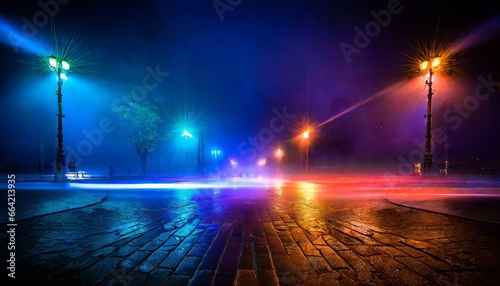 Dark background of empty foggy wet asphalt in the night illuminated by a searhlight