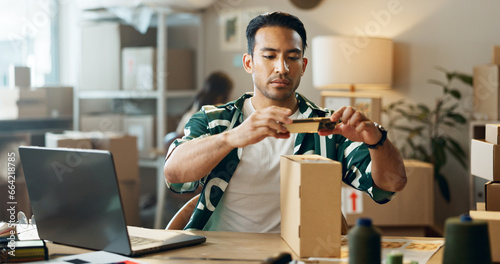 Asian man, phone and box in logistics or small business for inventory inspection or pricing for ecommerce. Male person or store owner with mobile smartphone, laptop and boxes for picture scan photo