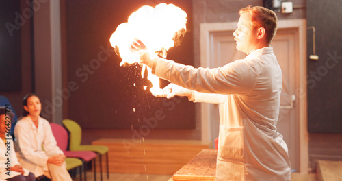 Bild auf Leinwand Chemistry, students and fire experiment with teacher for development, innovation and knowledge in hall