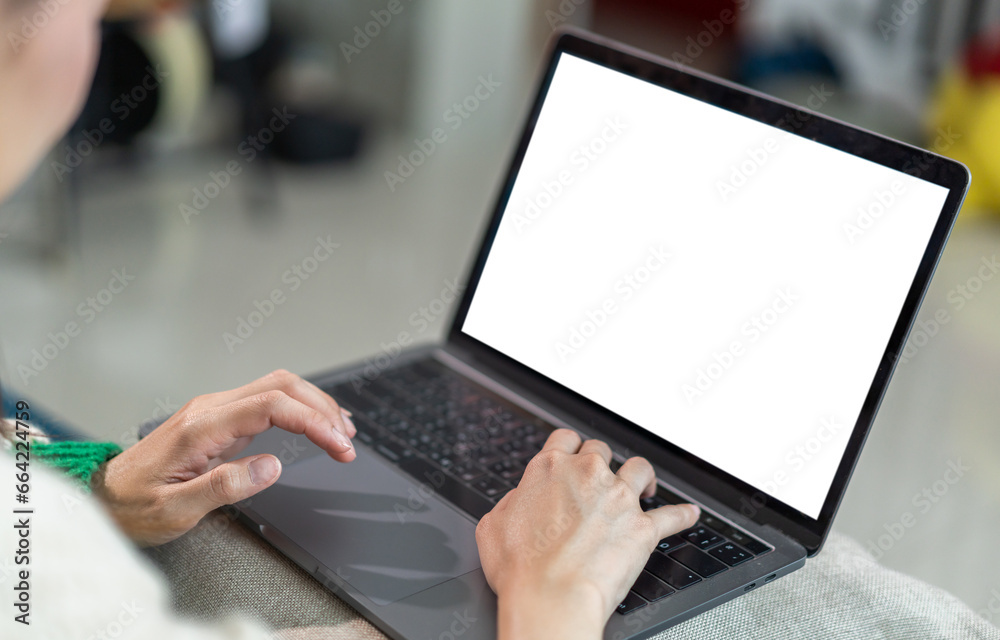 Woman working with modern laptop computer blank white desktop screen for advertising, mockup, technology, advertising, search information, creative design on table Woman working with modern laptop computer blank white desktop screen for advertising, mockup, technology, advertising, search information, creative design on table