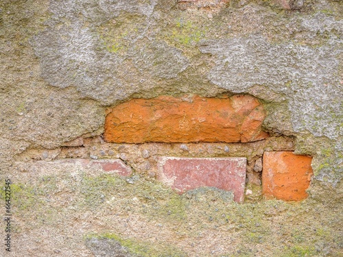 Aged, concrete wall with a weathered texture, with a subtle, gray-brown color palette photo