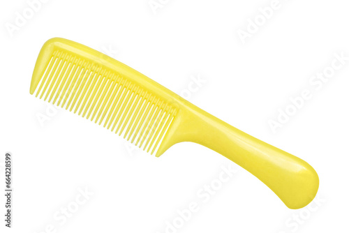 Yellow plastic comb on a white background. Comb close-up.