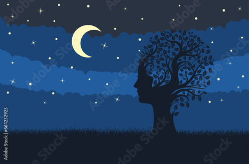 Tree with female head and grass at night