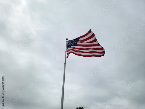 American flag in the breeze in a cloudy day