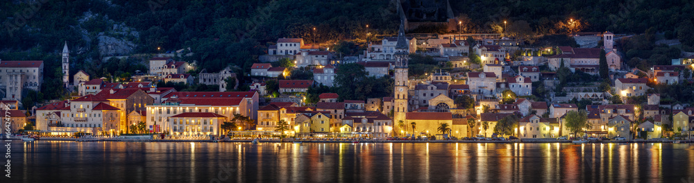 Panoramic view of the  Perast old town at night with lights.