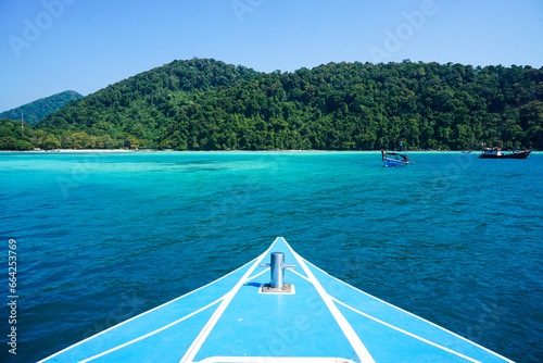 Speed boat bow while heading with beautiful water and blue sky to Moo Koh Surin island, Thailand. Speed boat bow while sailing on the blue ocean © SandyHappy