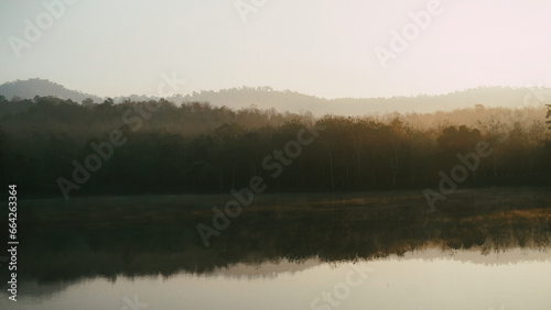 Panorama Of Autumn River Landscape In Jet Khot Nature Study Centre, THAILAND At Sunset. Sun Shine Over Water Lake Or River At Sunrise. Nature At Sunny Morning. Woods With Orange Foliage On Riverside © SandyHappy