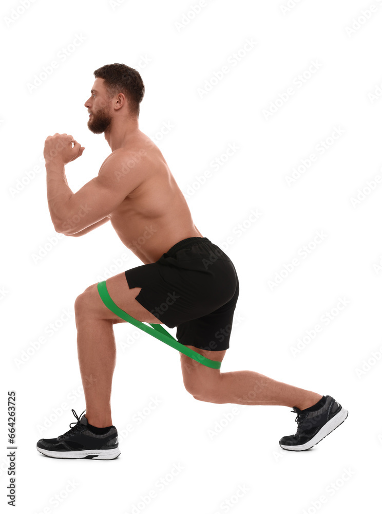 Young man exercising with elastic resistance band on white background