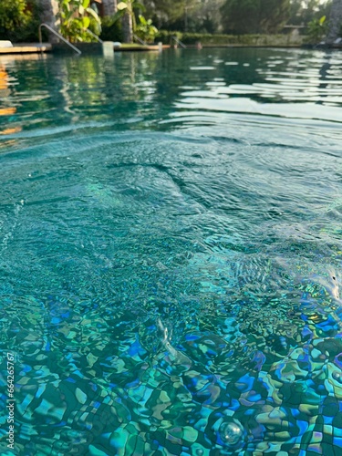 Clear rippled water in outdoor swimming pool