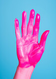 a person's hand in paint on a colored background, gesture, fingers, palm, deaf-mute language, art, artist, drawing, body art