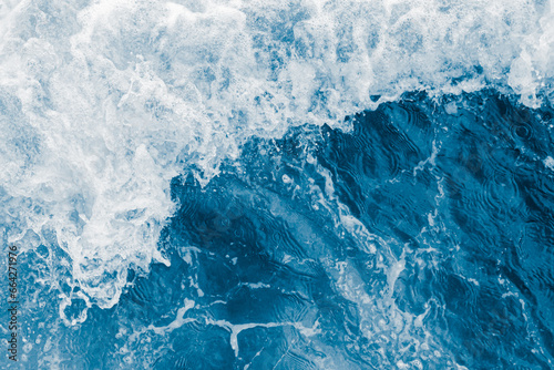 Dark blue sea ocean wave and white foam