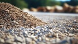Close up of gravel pile on a construction site for road building Background includes sand and selective focus