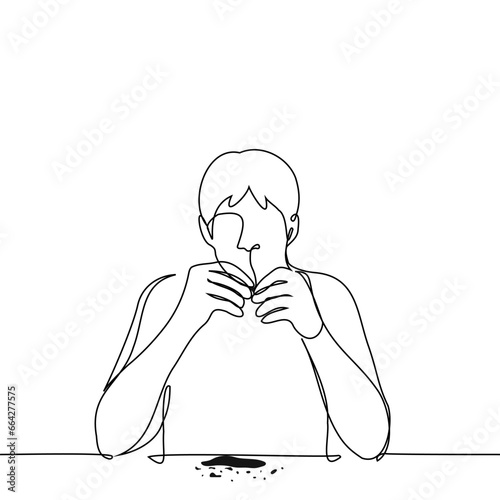 man sitting at the table peeling sunflower seeds to eat - one line art vector. concept of gnawing sunflower seeds, snacks