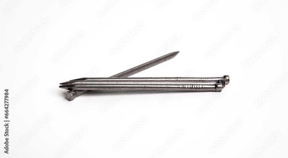 Three Silver Shiny Sharp Metal Nails Closeup Photo Isolated On White Background Three Silver Shiny Sharp Metal Nails Closeup Photo Isolated On White Background