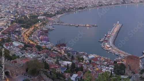 Aerial view of alanya and harbour with ships at evening. Time-lapse.