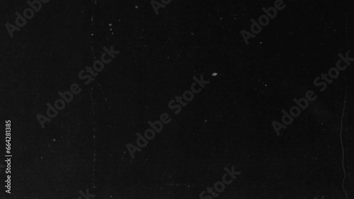 Noise, dust and grain on old damaged film surface. Dynamic film rolling effect. texture Retro vintage effect of over exposed strip. video backgrounds