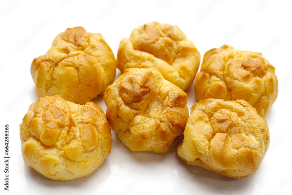Cream puffs on white background