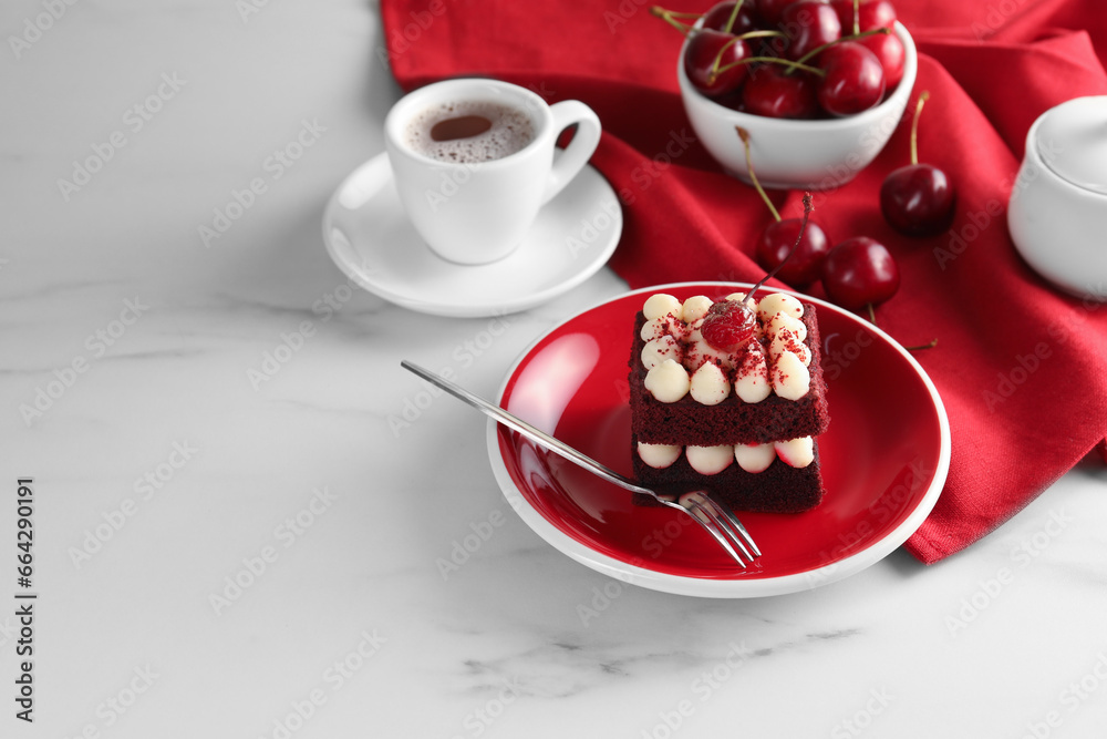 Piece of delicious red velvet cake served on white marble table, space for text