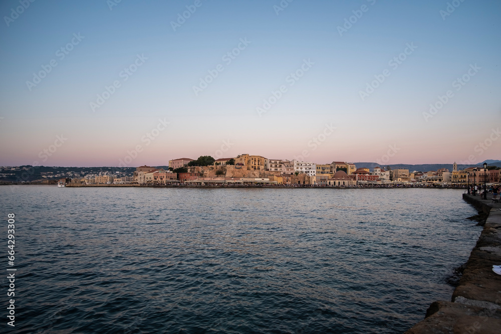 Chania's harbour cityscape in the shore of quiet Mediterranean water edge