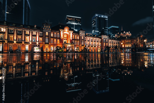 Photography Night city view of business buildings around the Marunouchi side of Tokyo Station after rain