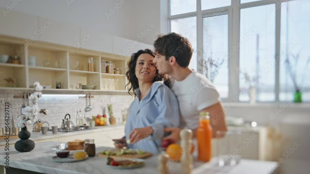 Joyful spouses preparing meal for romantic breakfast in kitchen. Couple cooking. Joyful spouses preparing meal for romantic breakfast in kitchen. Couple cooking.