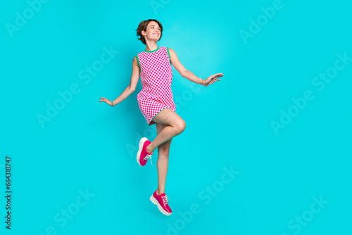Fototapeta Naklejka Na Ścianę i Meble -  Full size photo of jumper model have good time atmosphere new brand introduction dreamy look novelty lady isolated on blue color background