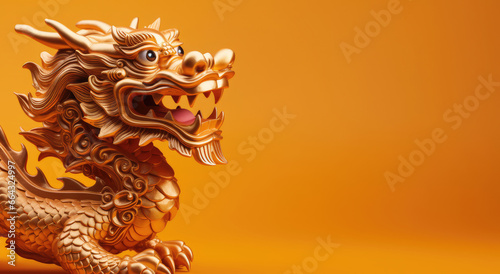 Golden dragon statue on yellow background. Year of the Dragon, Chinese New Year