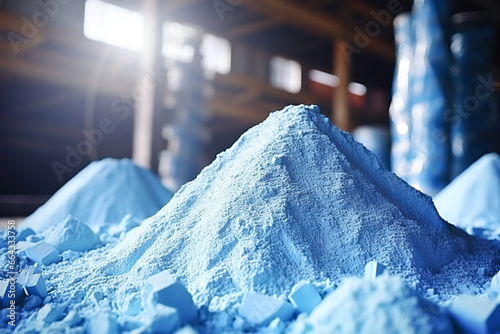 Blue heap or pile of salt granules of phosphorus fertilizers on chemical plant. photo
