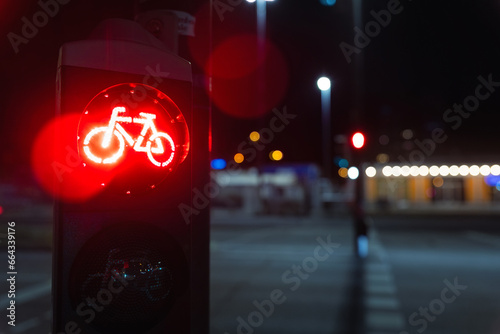 Bicycle stop red warning lamp sign on traffic light road highway driveway drive crossroad intersection evening dark time german city. Bike forward movement prohibited on semaphore signal city street