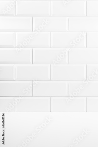 Abstract interior with white ceramic rectangle tiles on wall and wood floor or shelf  mockup  empty. Template for presentation  showing  design in soft light minimalistic style.