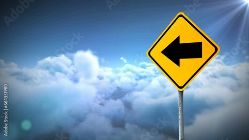 Animation of left side arrow signboard against clouds in the blue sky photo