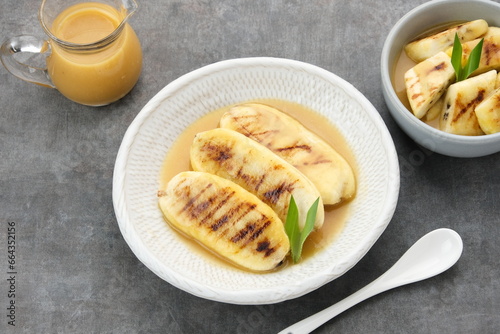 Pisang Gapit or Pisang Epe, grilled banana with palm sugar sauce. Indonesian traditional food. 