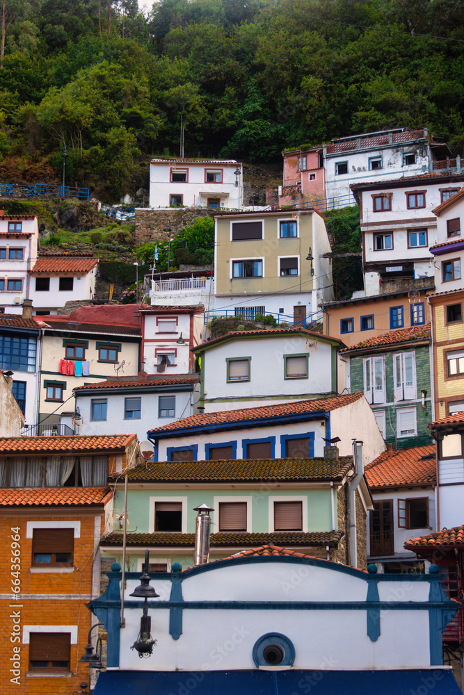 Colorful, stacked houses on the mountainside in Cudillero, Spain, a charming coastal town