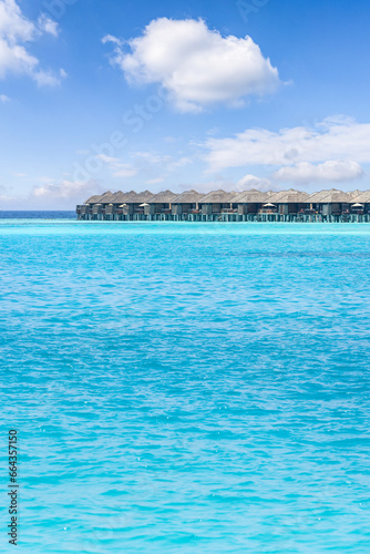 Maldives paradise scenery. Tropical aerial landscape, seascape and water villas with amazing sea and lagoon bay, tropical nature. Exotic tourism popular destination banner. Panoramic summer vacation