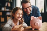 Daughter and father play piggy bank. Dad teaches his daughter to keep money in a piggy bank.