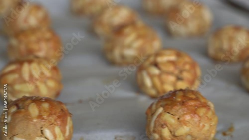 Pine nut panellets fresh from the oven. Typical snack eaten on the feast of All Saints in Catalonia.  photo