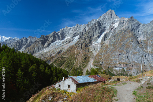 The panorama of Val Ferret, one of the Italian valleys that directly overlook Mont Blanc, during an autumn morning, near the town of Entreves, Valle d'Aosta, Italy - 2 October 2023.