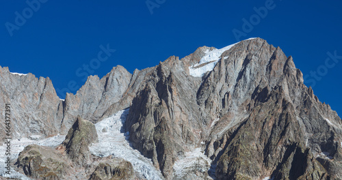 One of the most iconic mountains of the Mont Blanc Alps, Le grandes Jorasses, seen from the Italian side, near the town of Courmayeur, Valle d'Aosta, Italy - 2 October 2023. photo