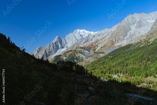 Mont Blanc, the highest top of the Alps, seen by the paths of the Val Ferret, during a sunny October day, near the town of Courmayeur, Valle d'Aosta, Italy - October 2023 © Roberto