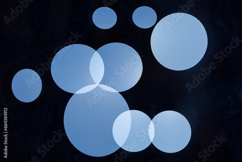 Nine blue circles on black background 