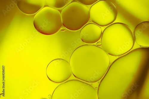 Closeup of bubbles of olive oil. Gold green