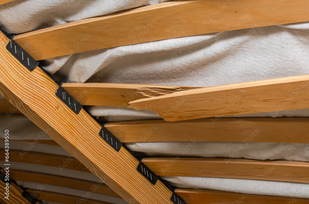 Broken wooden slats on a bed