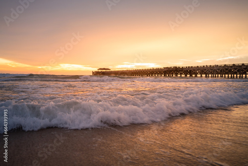 Fototapeta Naklejka Na Ścianę i Meble -  Beautiful Romantic Sunset sea sand beach. Landscape of paradise tropical island beach, sunrise shot. beach landscape. Beautiful cloudscape over the sea sunrise shot.