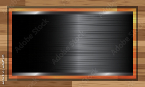 black steel blank board on wooden background. luxury. photo