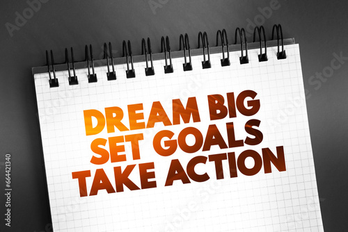 Dream Big Set Goals Take Action text quote on notepad, concept background