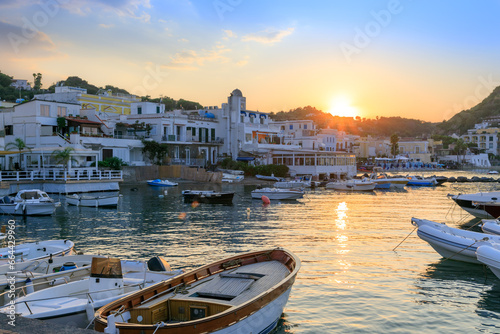 Townscape of Lacco Ameno in Ischia Island. View of tourist port at sunset.